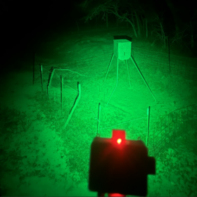 Hog feeder light illuminating hogs at night without spooking them